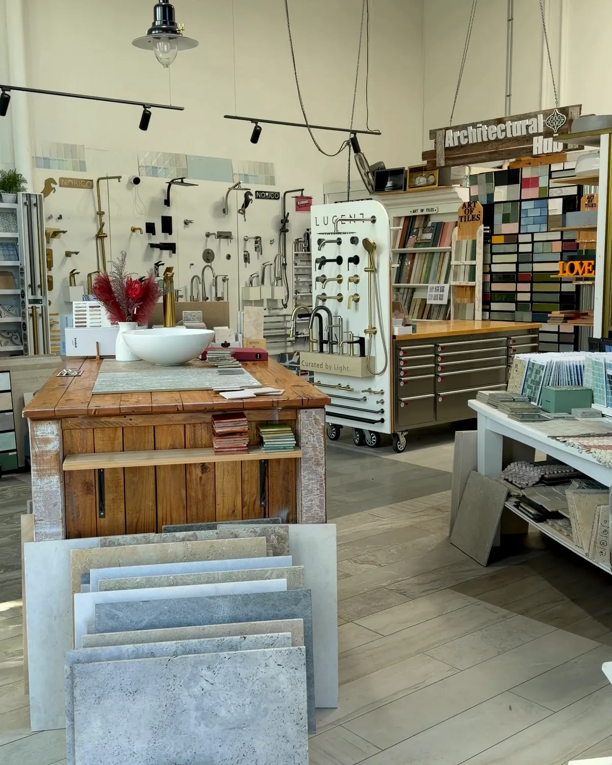 The Architectural Hub with tapware, tile samples and the selection bench